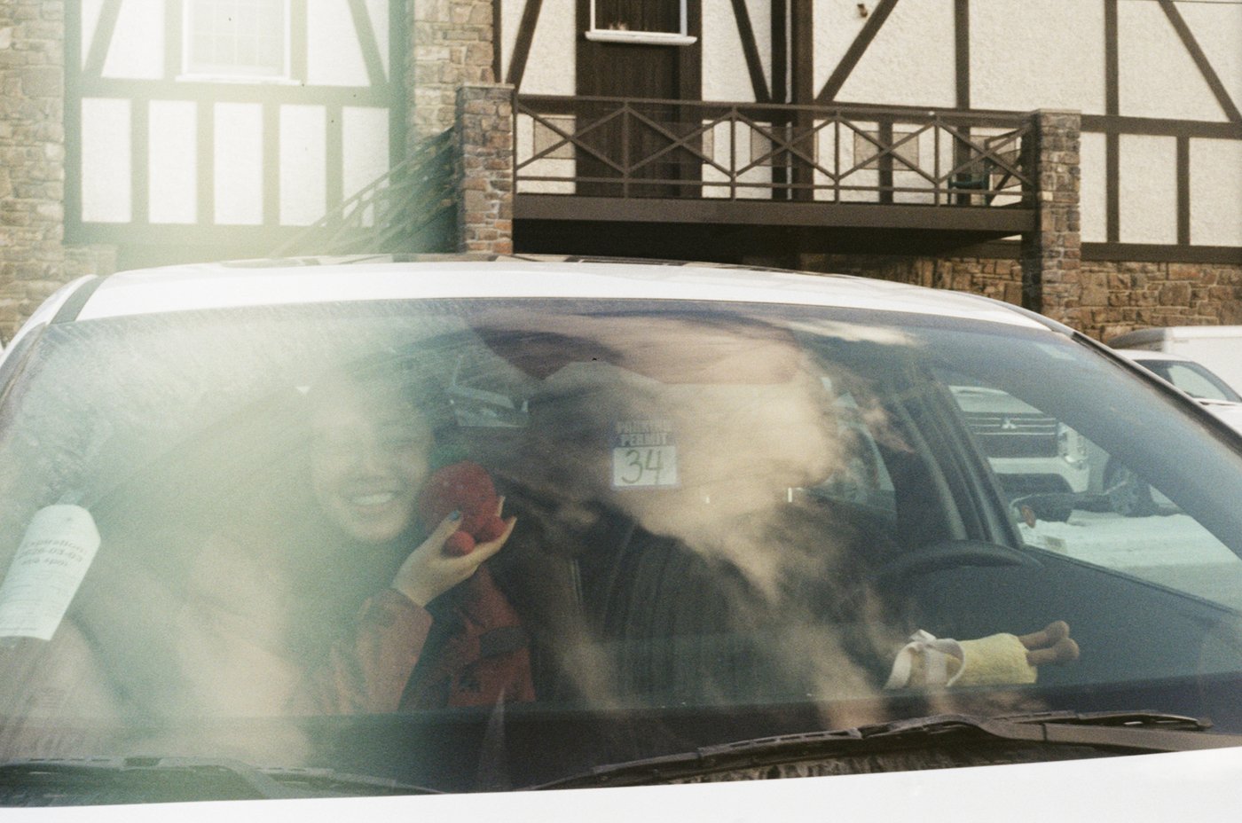 Looking out through a car window at a lodge in Banff