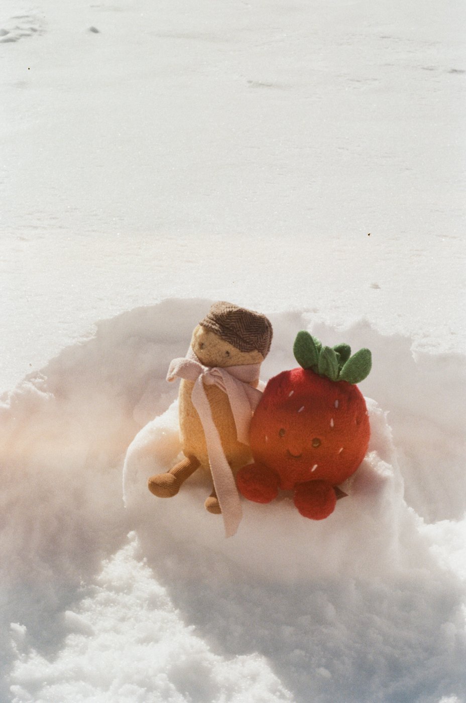 A snowman decorated to look like a strawberry