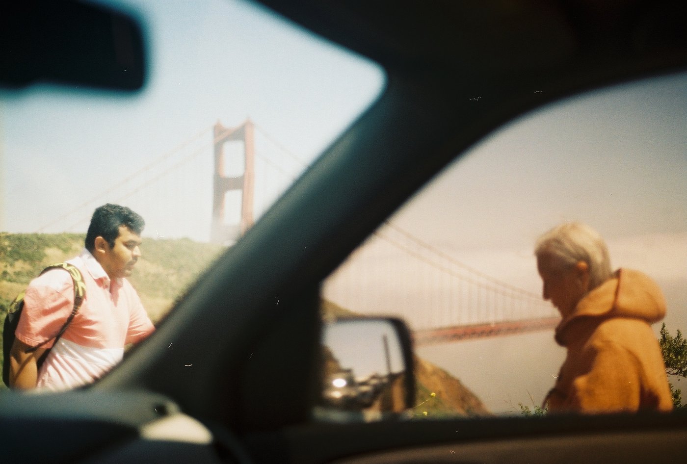 Looking through a car window at people outside