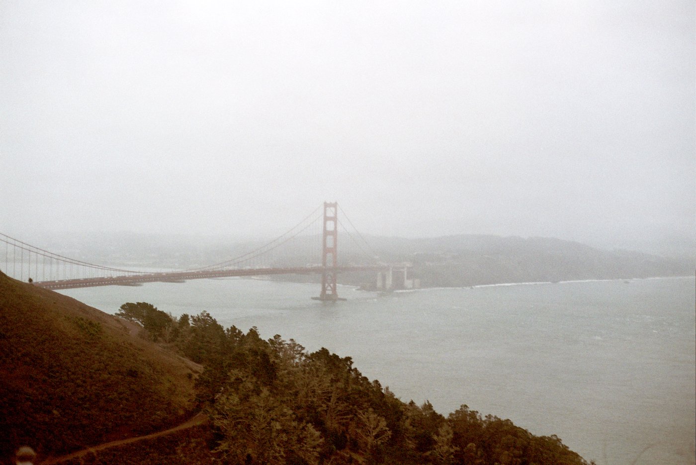 A winding road through foggy hills
