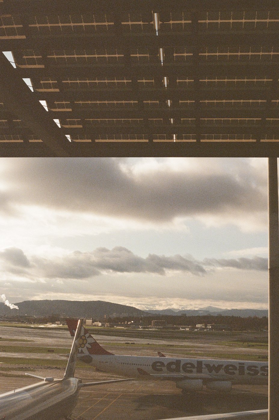 Solar panels and a plane on the tarmac at the airport