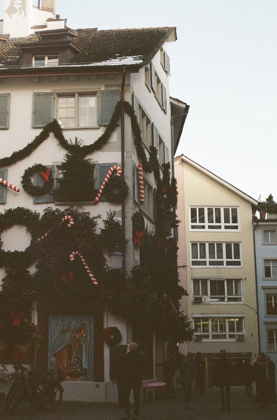 Building decorated with holiday wreaths and candy canes