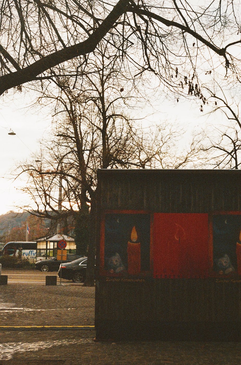 A mountainside restaurant lit up at dusk