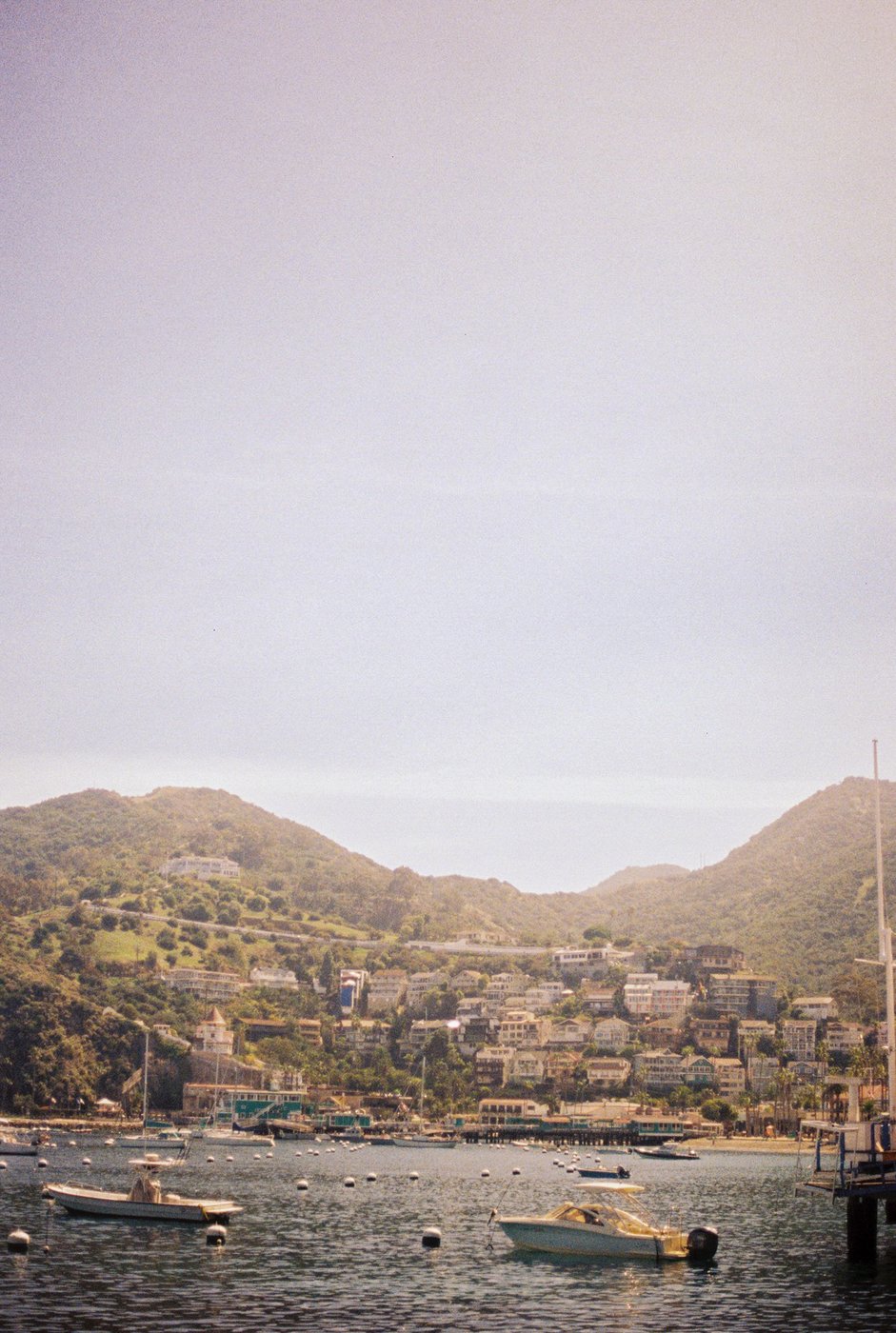 A coastal town view with boats in the water