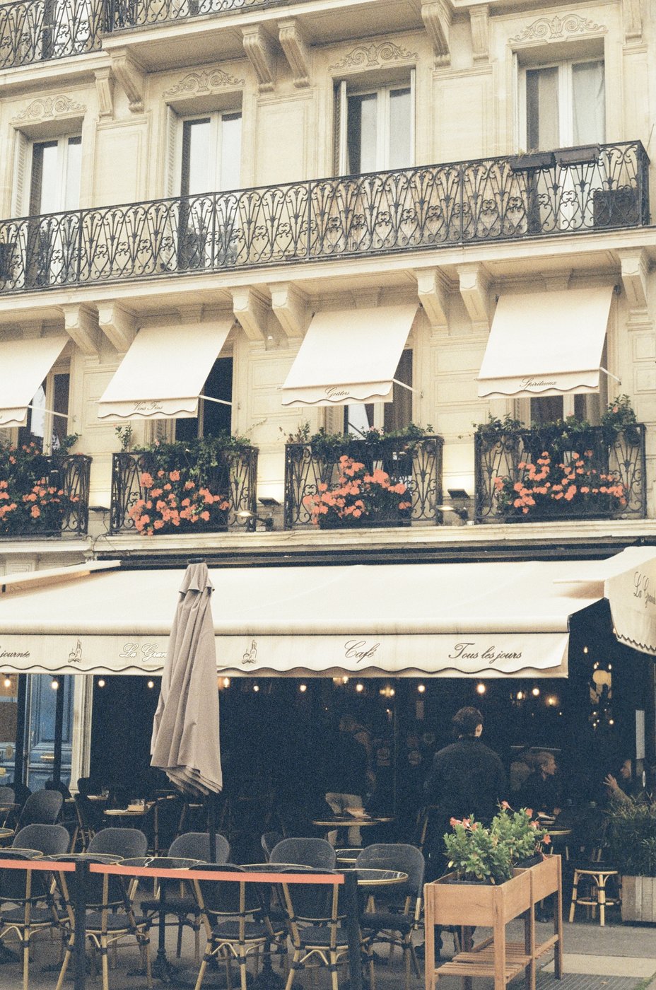 A café terrace lit up in the evening