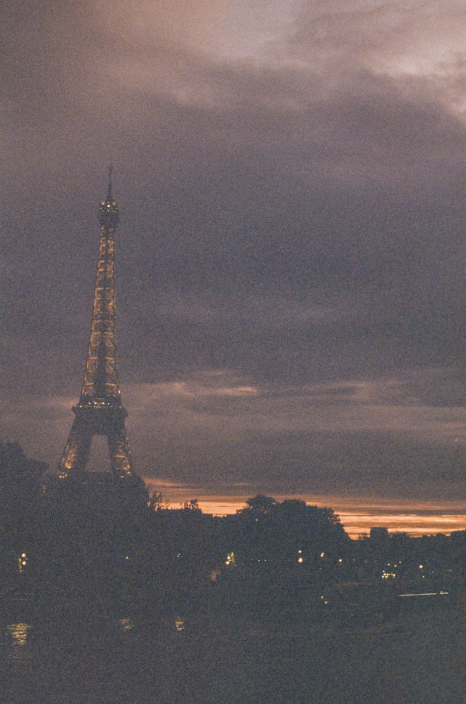 The Eiffel Tower silhouetted against a dramatic sunset