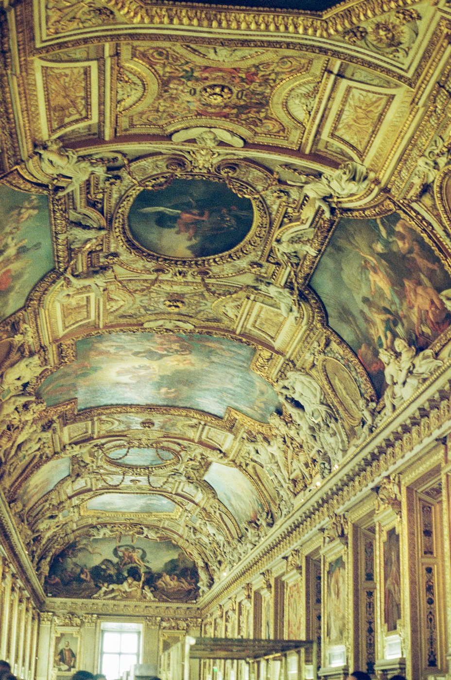 Ornate painted ceiling inside a Paris gallery