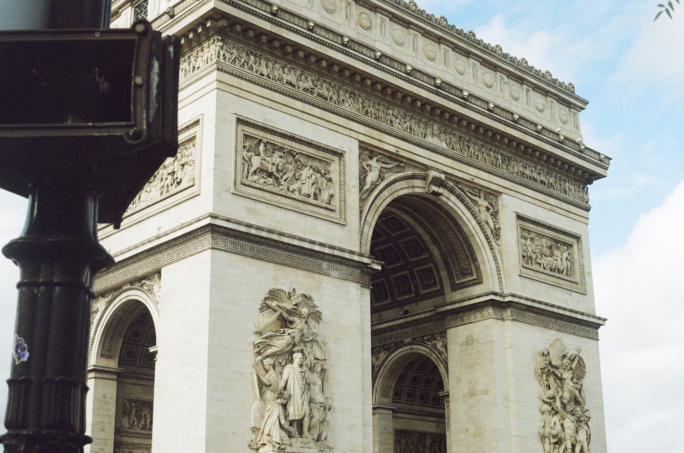 The Arc de Triomphe against a blue sky