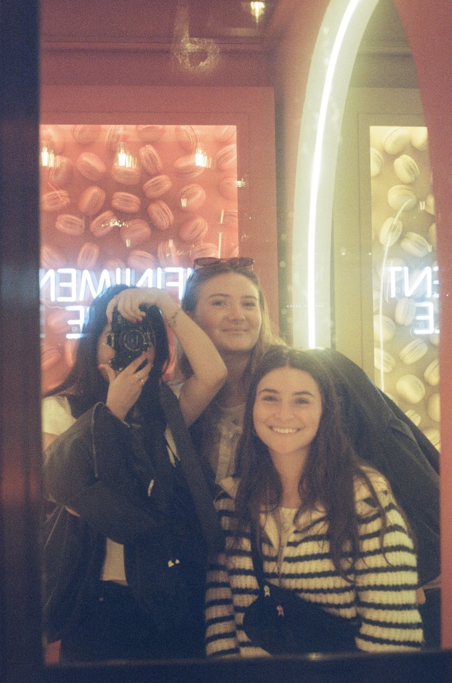 Friends taking a photo booth picture together