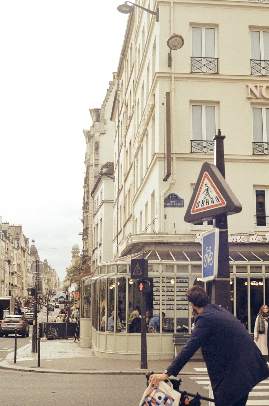 Street corner in Paris with a cyclist