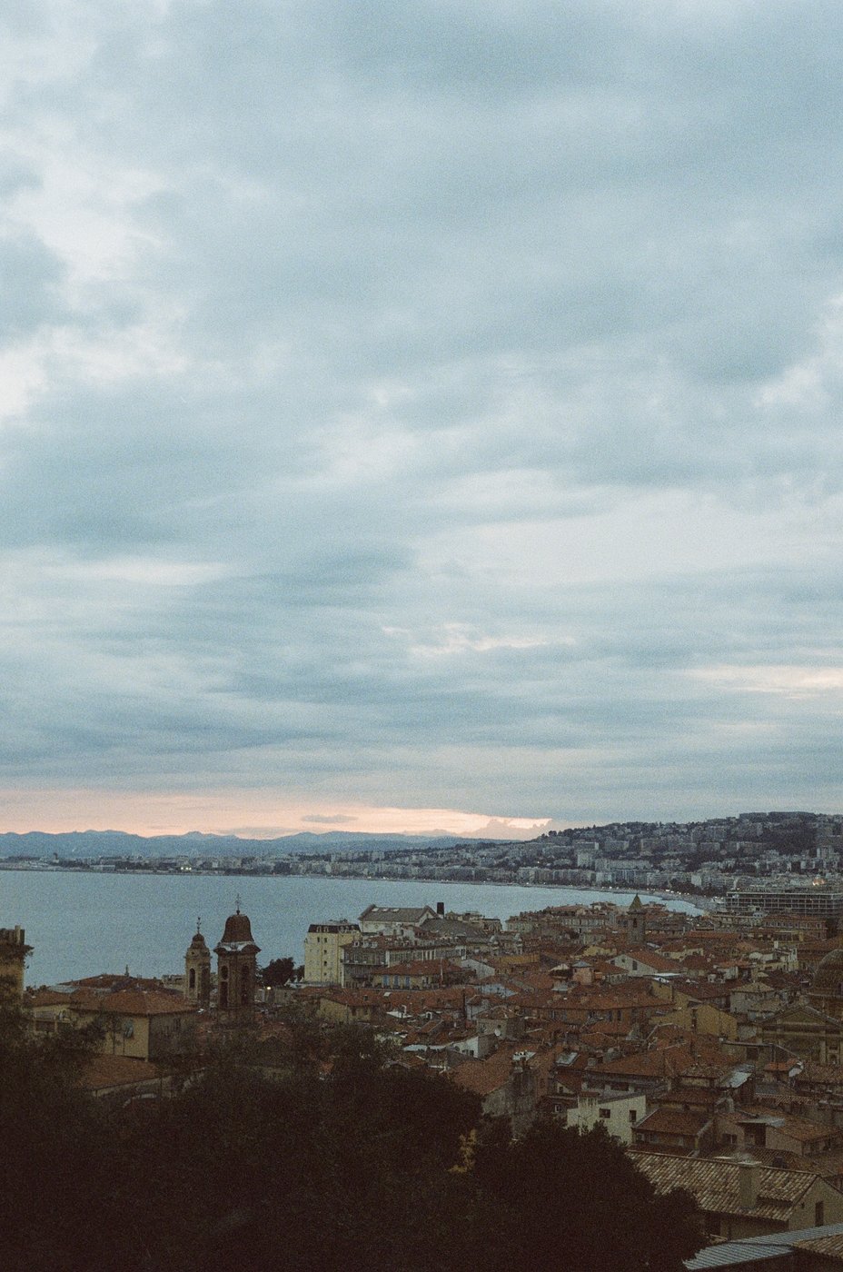 View over Nice rooftops toward the bay at dusk