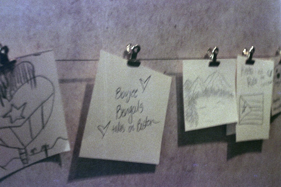Hand-drawn trip notes clipped to a line