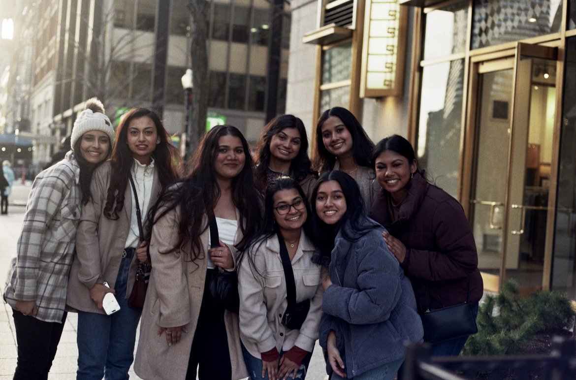 Group of friends posing on a city street